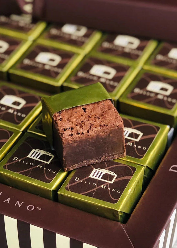 Close-up of Dello Mano chocolate brownies in a box